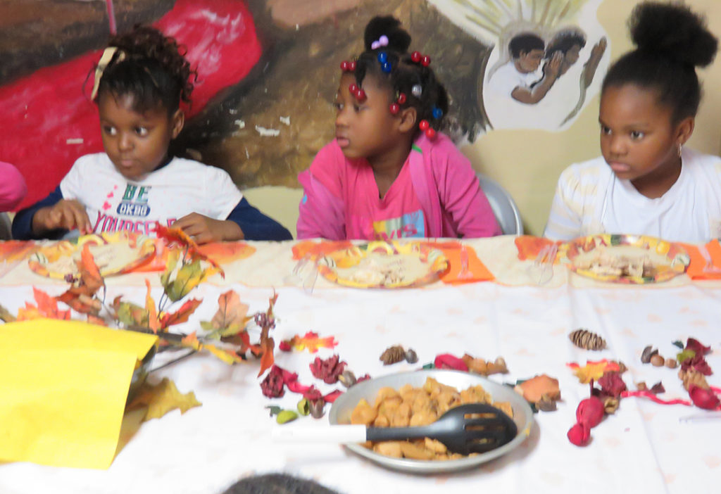 Children who are enjoying their Thanksgiving meal